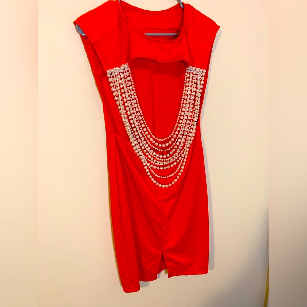 Stretchy orange dress with a pearl design..open back